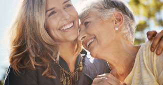 Mature daughter with mother happily spending time together. 